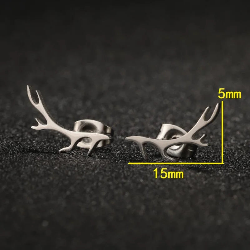 Silver antler-shaped earrings on a dark textured background with measurements indicated.